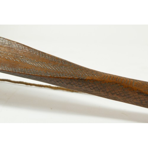 411 - A Canadian bow with cross hatched carved decoration, 148cm, with owners label 