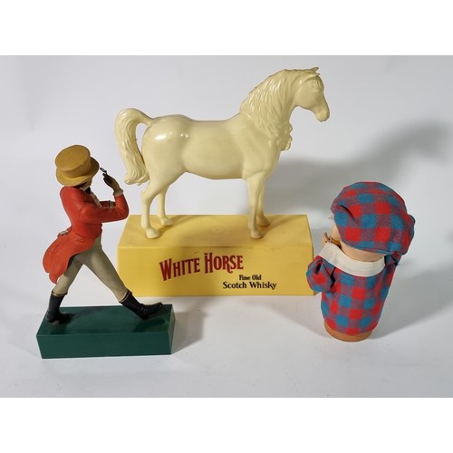 357 - A White Horse Fine Old Whiskey display figure, in the form of a white horse on a plinth, 26cm, a Jon... 