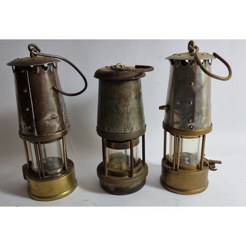 334 - Two Eccles Safety Lamps, one a 6RS, stamped 76, another a SL stamped 160, together with a Wolf Miner... 