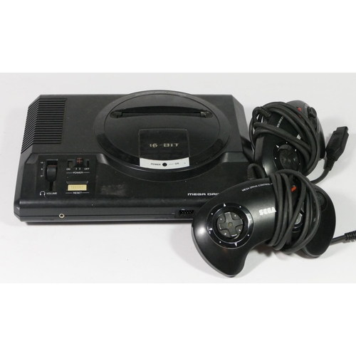 451 - A Sega Mega Drive (serial No. 110084379), together with two controllers