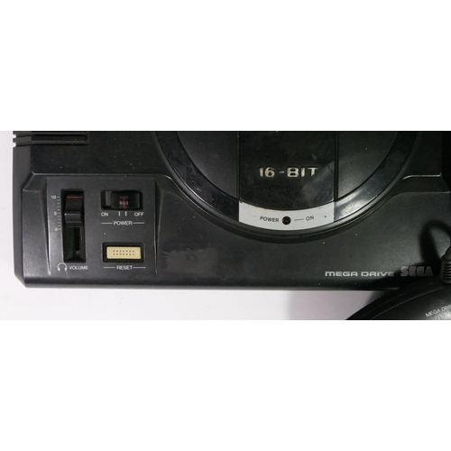 451 - A Sega Mega Drive (serial No. 110084379), together with two controllers