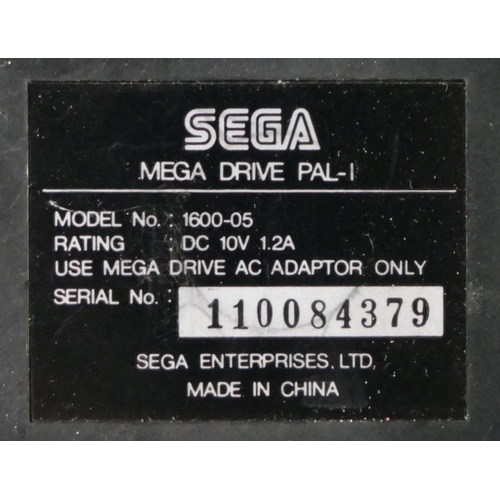 451 - A Sega Mega Drive (serial No. 110084379), together with two controllers