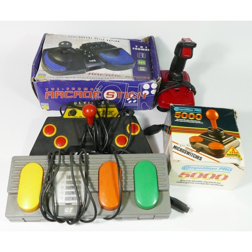 452 - Five third party controllers, to include a Competition Pro 500 (boxed), a Logic 3 Tri-Format Arcade ... 