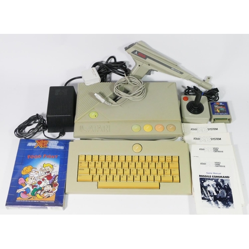 466 - An Atari XEGS system (serial No A1 793005452), with manual, keyboard (serial No R1784 002654), with ... 