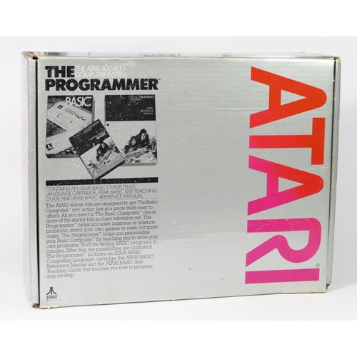 477 - An Atari 400 (serial No 050 122858), boxed,  two joysticks and two paddle controllers, with manual, ... 