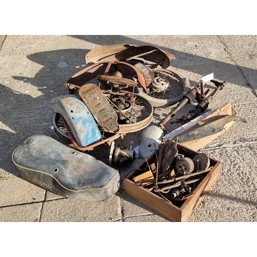 132 - An autojumblers lot to include a c.1968 Triumph Tiger Cub front forks, chain guard and engine cases,... 