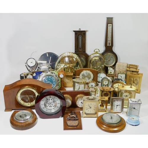 69 - A collection of mantle clocks, barometers and a ships wall clock, makers to include - Swiza, Smiths,... 