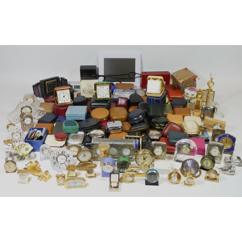 71 - A large collection of miniature novelty clocks, together with a selection of traveling alarm clocks.... 