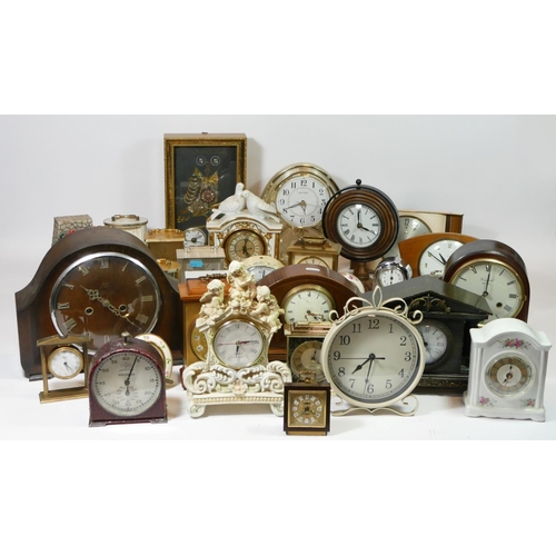 73 - Four boxes of mantle clocks, having manual wind and quartz movements, to include an inlaid mahogany ... 
