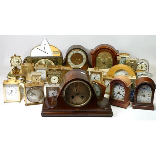 73 - Four boxes of mantle clocks, having manual wind and quartz movements, to include an inlaid mahogany ... 