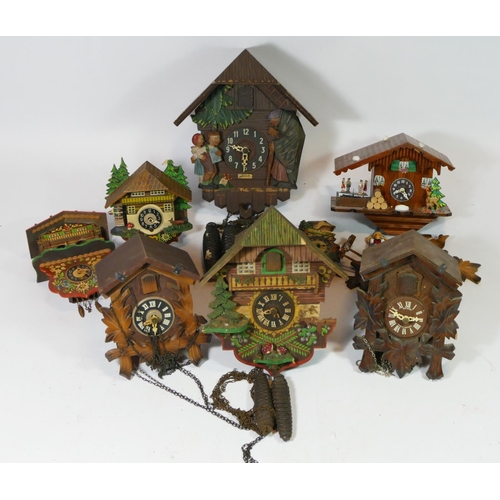 75 - A collection of seven mid 20th century cuckoo clocks, having manual wind Swiss & German one day move... 