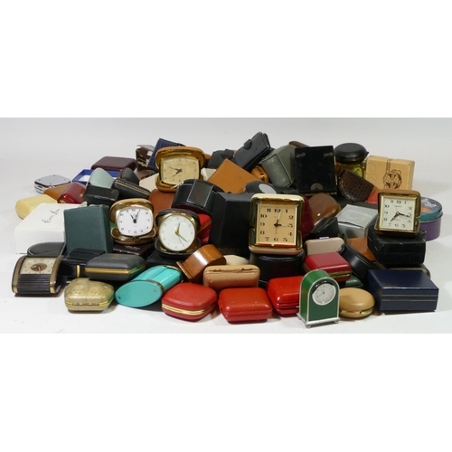 79 - A large collection of mid 20th century and later traveling alarm clocks, together with a selection o... 