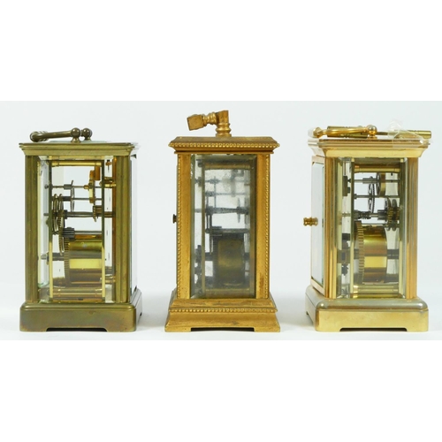 90 - An early 20th century gilt brass 8 day carriage clock, together with two French examples. (3)
