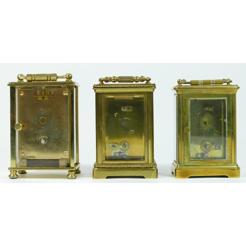 92 - Two French brass cased 8 day carriage clocks, together with an English 8 day example. (3)
