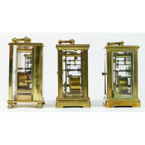 92 - Two French brass cased 8 day carriage clocks, together with an English 8 day example. (3)