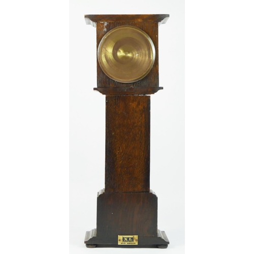 95 - A miniature oak cased longcase clock, silvered dial, brass chapter ring with manual wind movement.
4... 