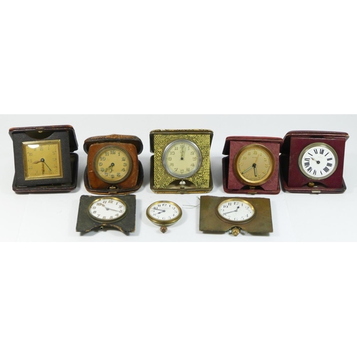 96 - A collection of eight early 20th century traveling alarm clocks, having 8 day movements. (8)