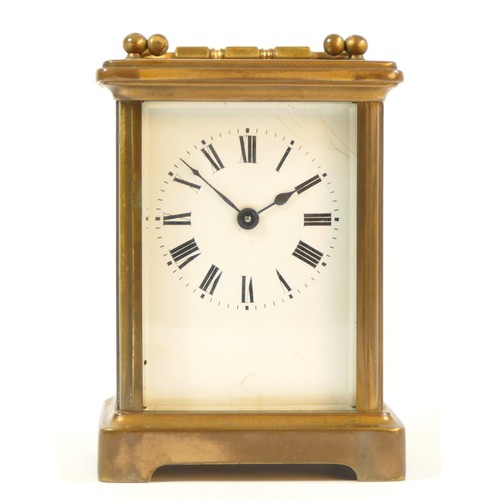 84 - An early 20th Century 8 day carriage clock, brass cased, with bevel edged glass panels, complete wit... 