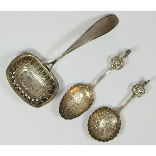 112 - A 19th century Dutch silver sifter spoon, date letter 1841, and two later Dutch silver christening s... 