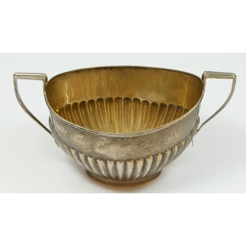 122 - A silver sugar bowl, Birmingham 1938, with half fluted decoration, 84gm