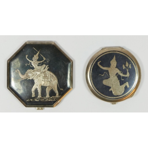 126 - Two Siamese silver and enamel compacts, with Deity decoration, mirrors in both.