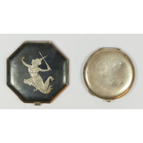 126 - Two Siamese silver and enamel compacts, with Deity decoration, mirrors in both.