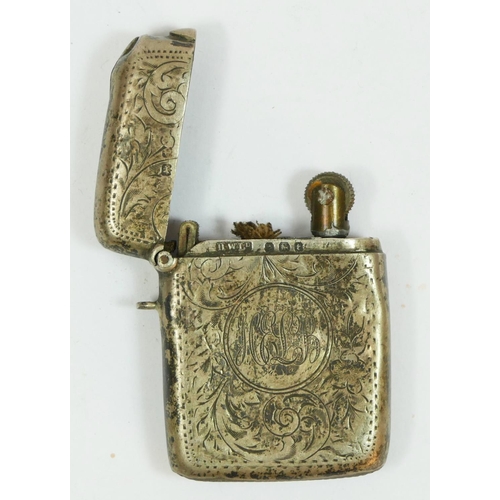 128 - A silver vesta case converted to a cigarette lighter, Birmingham 1918, initialed.