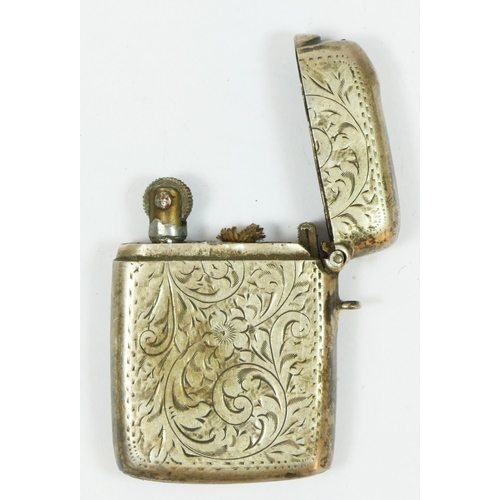 128 - A silver vesta case converted to a cigarette lighter, Birmingham 1918, initialed.