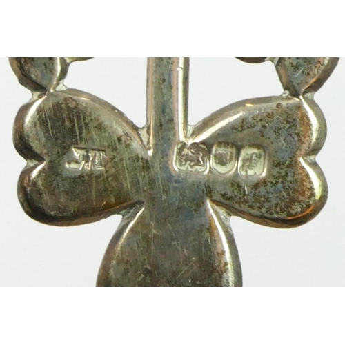 131 - A cast silver nurses buckle, London 1902, with shamrock decoration, 41gm