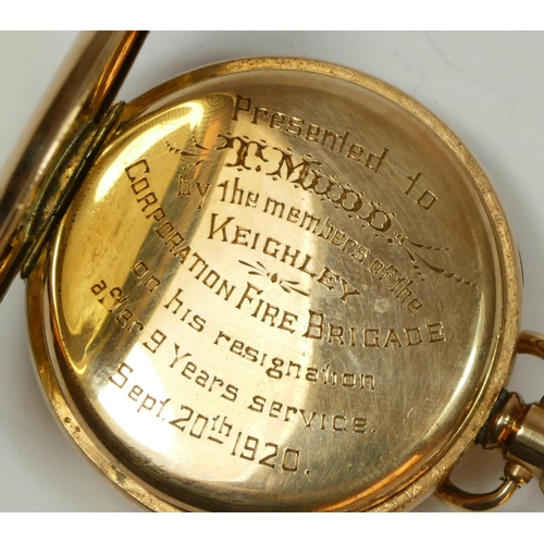 142 - Of Keighley Fire Brigade interest; a gilt metal open face keyless wind pocket watch, presentation in... 