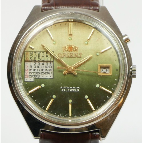 158 - Orient, a stainless steel calendar and date automatic gentleman's wristwatch, with graduated green d... 