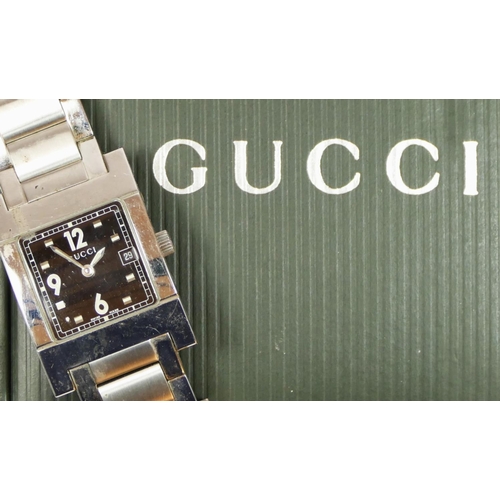 169 - Gucci, a stainless steel date quartz gentleman's wristwatch, ref. 7700L, serial number 0025993, case