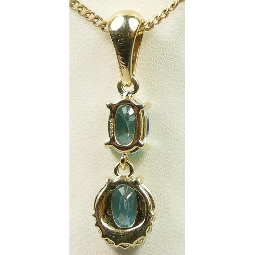 233 - A 9ct gold, blue topaz and synthetic spinel pendant, chain,