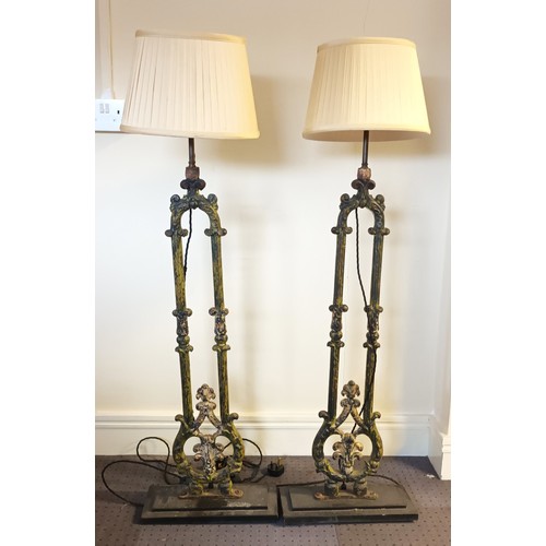 298 - A pair of Victorian cast iron terrace railings, converted to standard lamps, mounted on stepped cast... 