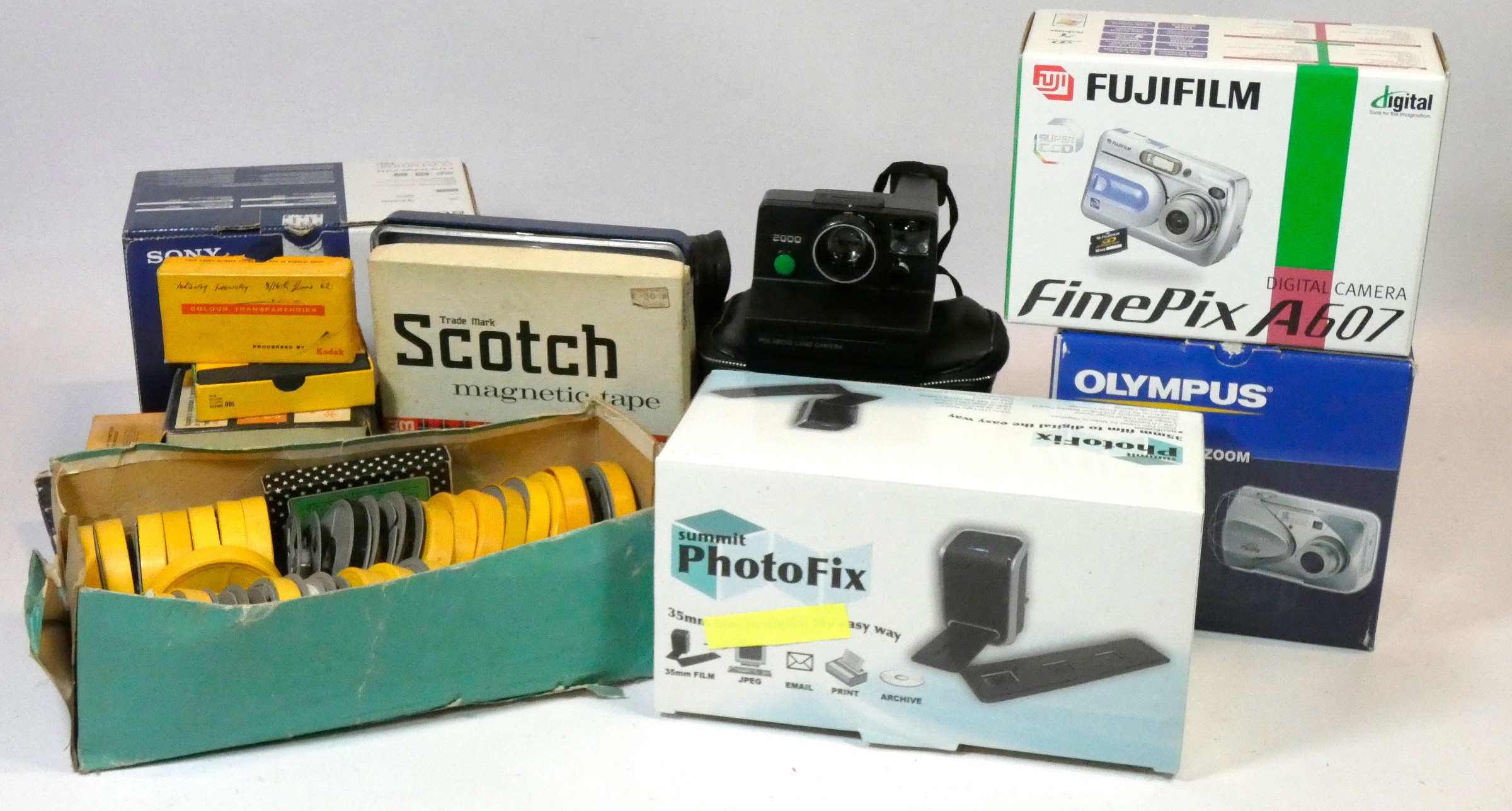 An Olympus C460 digital camera, boxed, a Fujifilm Finepix A607 digital
