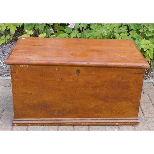 A stained pine Victorian blanket box, interior fitted with candle tray