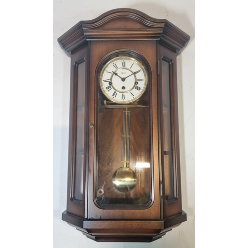 99 - Hermle, a mahogany cased striking and chiming wall clock with strike/silent lever, pendulum