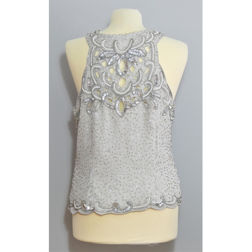 33 - Beaded and sequinned tops to include a Joseph Ribkoff spotted blouse with tags, size 12. (5)