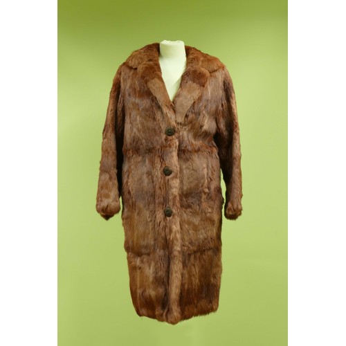 42 - An auburn 3/4 length fur coat, belted, size S/M, together with four fur stoles (5)
