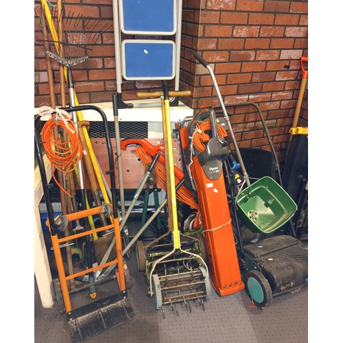 48 - A collection of garden tools and equipment to include a Flymo Vac, Flymo strimmers, electric and man... 