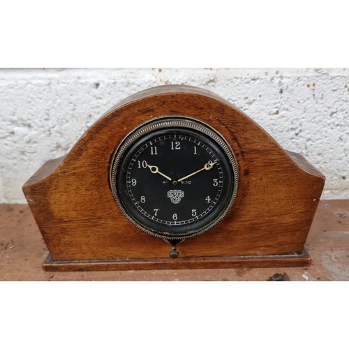 65 - A Smiths bezel winding dash board clock, serial number H-91.710, working order.
