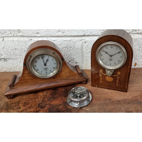 66 - A Smiths dashboard clock, serial number P-312.850, and two other Smiths dashboard clocks.