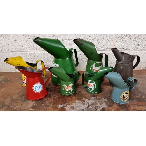 67 - A collection of 8 oil can pourers, including Castrol, Esso and Shell.