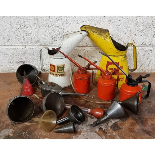 75 - A collection of oil can pourers and funnels.