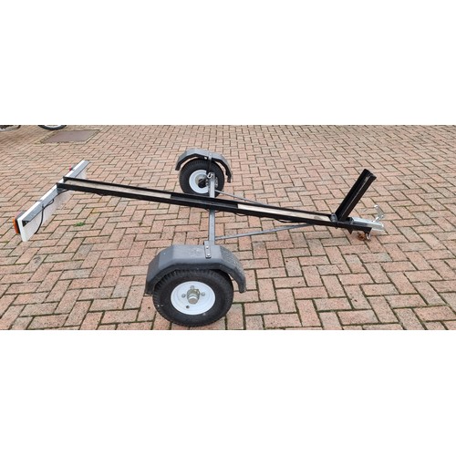 164 - A single light weight motorcycle trailer, with light board.