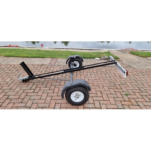 164 - A single light weight motorcycle trailer, with light board.