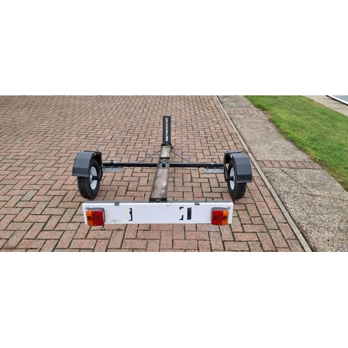 164 - A single light weight motorcycle trailer, with light board.