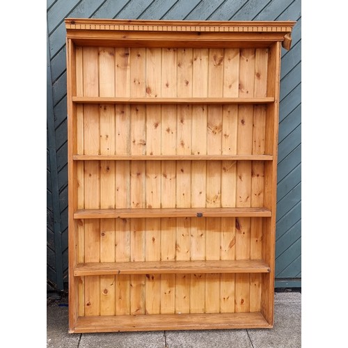 438 - A pine five shelf bookcase, 127 x 20 x 146cm and another similar 116 x 17 x 161cm