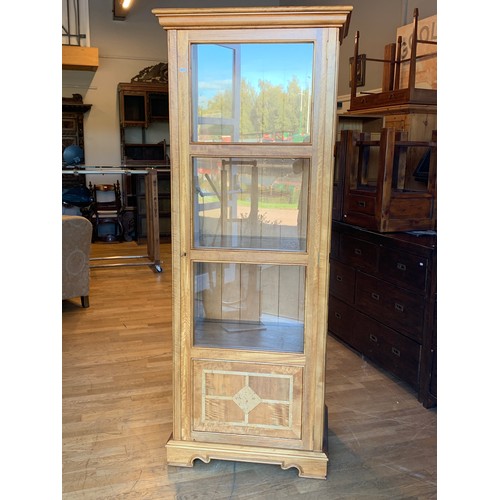 A Baker Bedford display full length lockable hinged door