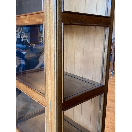 A Baker Bedford display full length lockable hinged door